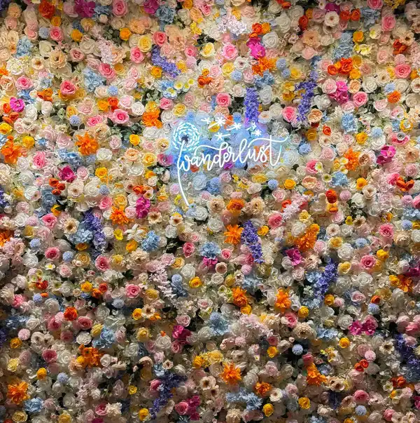 Flower wall photo backdrop at Wanderlust Las Vegas event venue